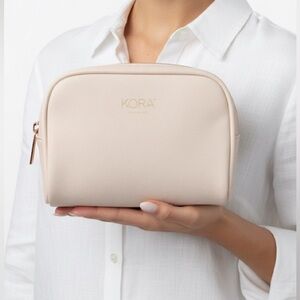Kora Organics Pink Cosmetics Bag with Rose Gold zipper detail